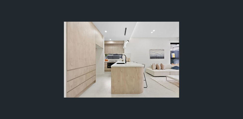 a kitchen with wooden cabinets and a large island