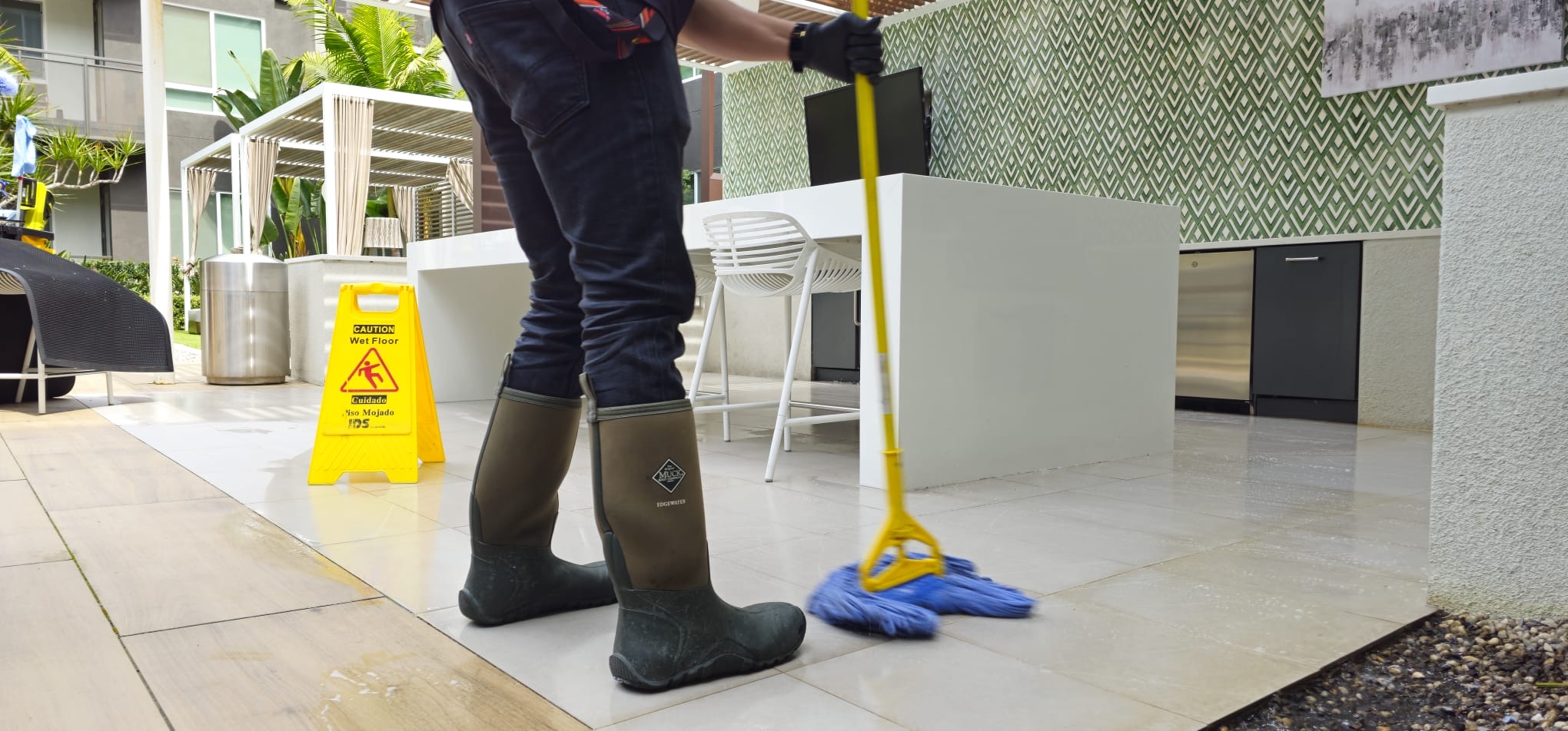 Worker cleaning a property common area