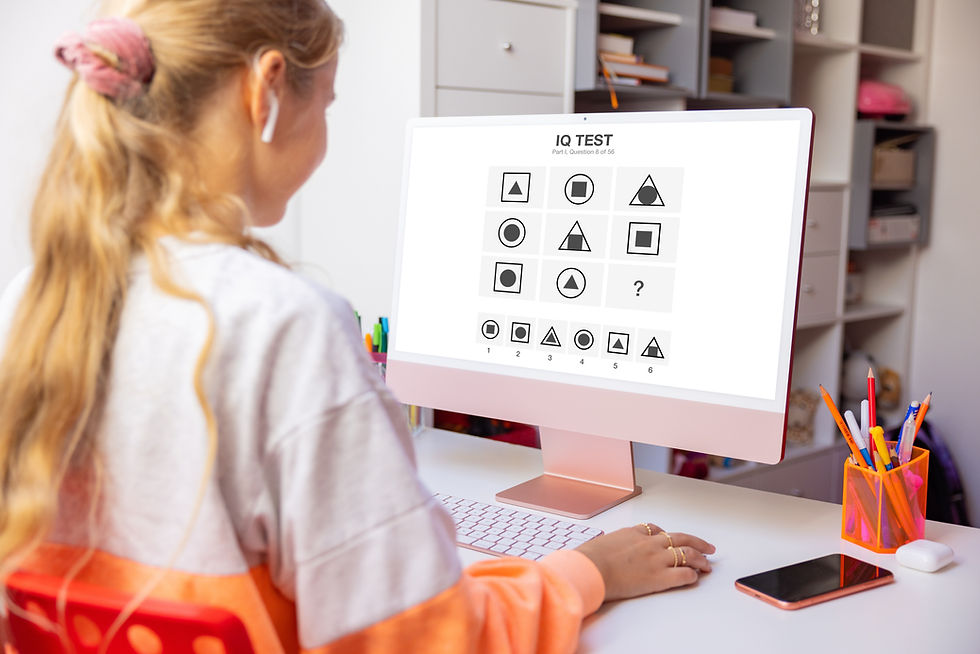 Girl studying at home and taking IQ test on computer.jpg