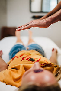 Josh Finfrock providing Reiki treatment for a patient in St Charles, Il.