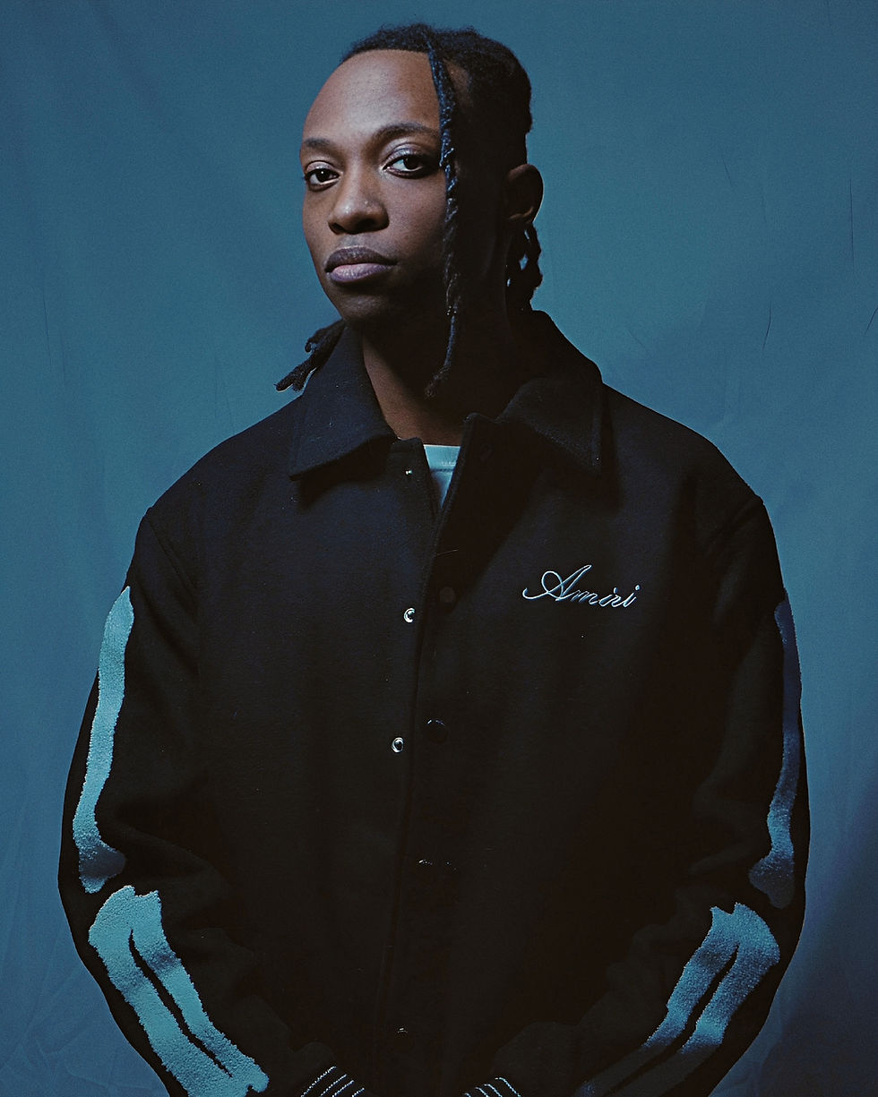 Shane Morgan, Music artist posed in front of blue backdrop