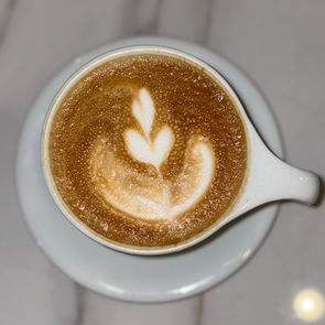 cappuccino with a flower design from a cafe in Manhattan