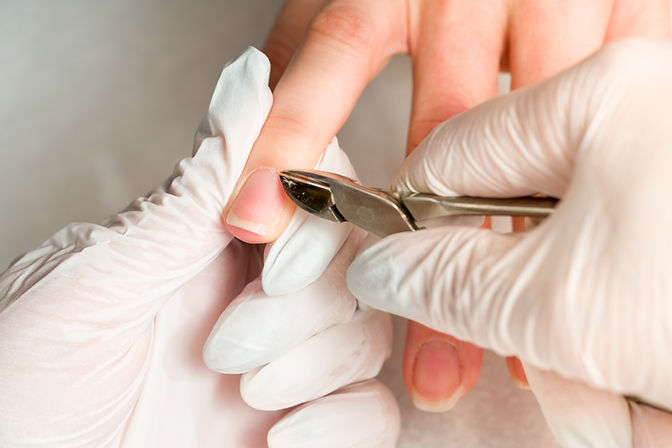 woman-nail-salon-receiving-manicure-by-beautician-with-nail-file-beauty-hand-care.jpg