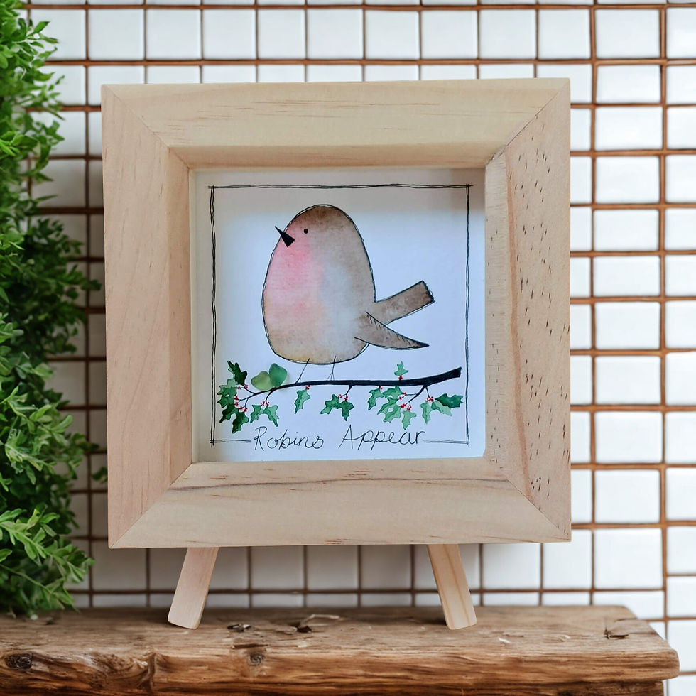 A picture of a robin, painted in watercolours and framed in a natural pine frame.