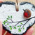 Thumbnail: A slate heart painted white and decorated with a brown sea glass robin perched on a branch.