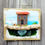 Thumbnail: Sustainable artwork hand painted onto reclaimed wood and decorated with a brown driftwood house & sea glass.