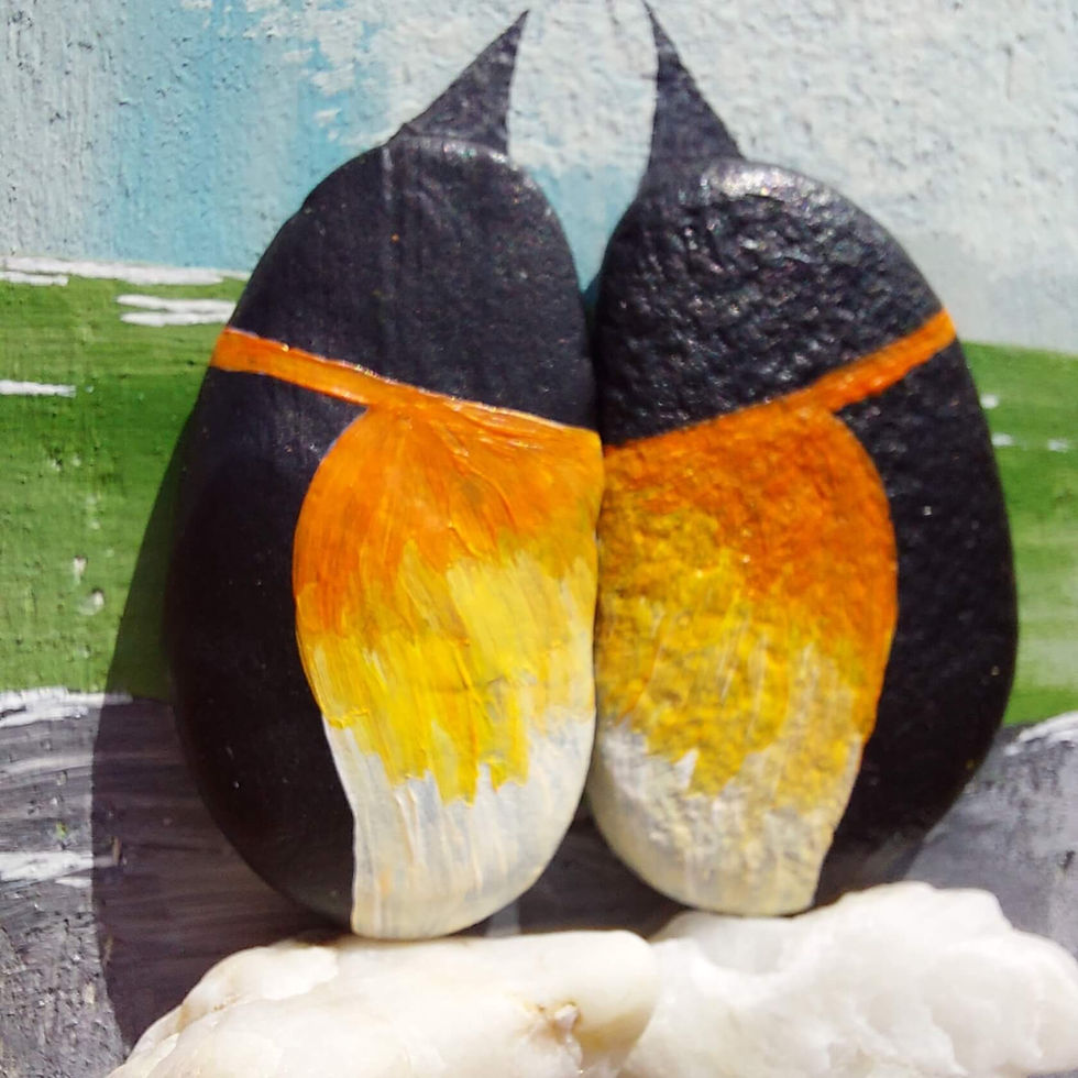 Thumbnail: Handmade pebble penguin wall art on reclaimed wood with sea glass, shells and a hand-painted coastal scene, celebrating love.