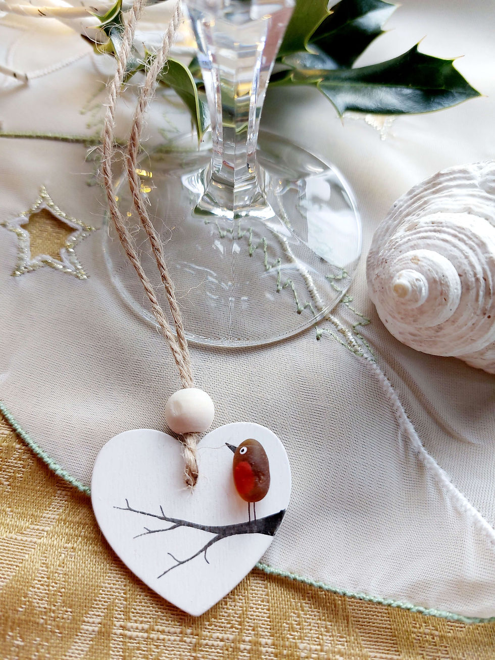 Thumbnail: White wooden heart hanging decoration embellished with a brown sea glass robin perched on a branch.