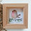 Thumbnail: A picture of a robin, painted in watercolours and framed in a natural pine frame.