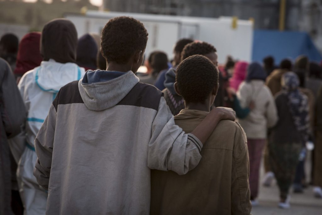 Migrants arrive at the Italian port of Augusta in Sicily. They are greeted by Save the Children staff whilst awaiting processing by Italian authorities.