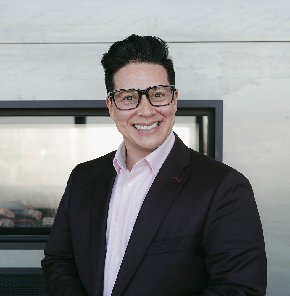 Relationship Coach Jordan Garcia wearing a suit and glasses