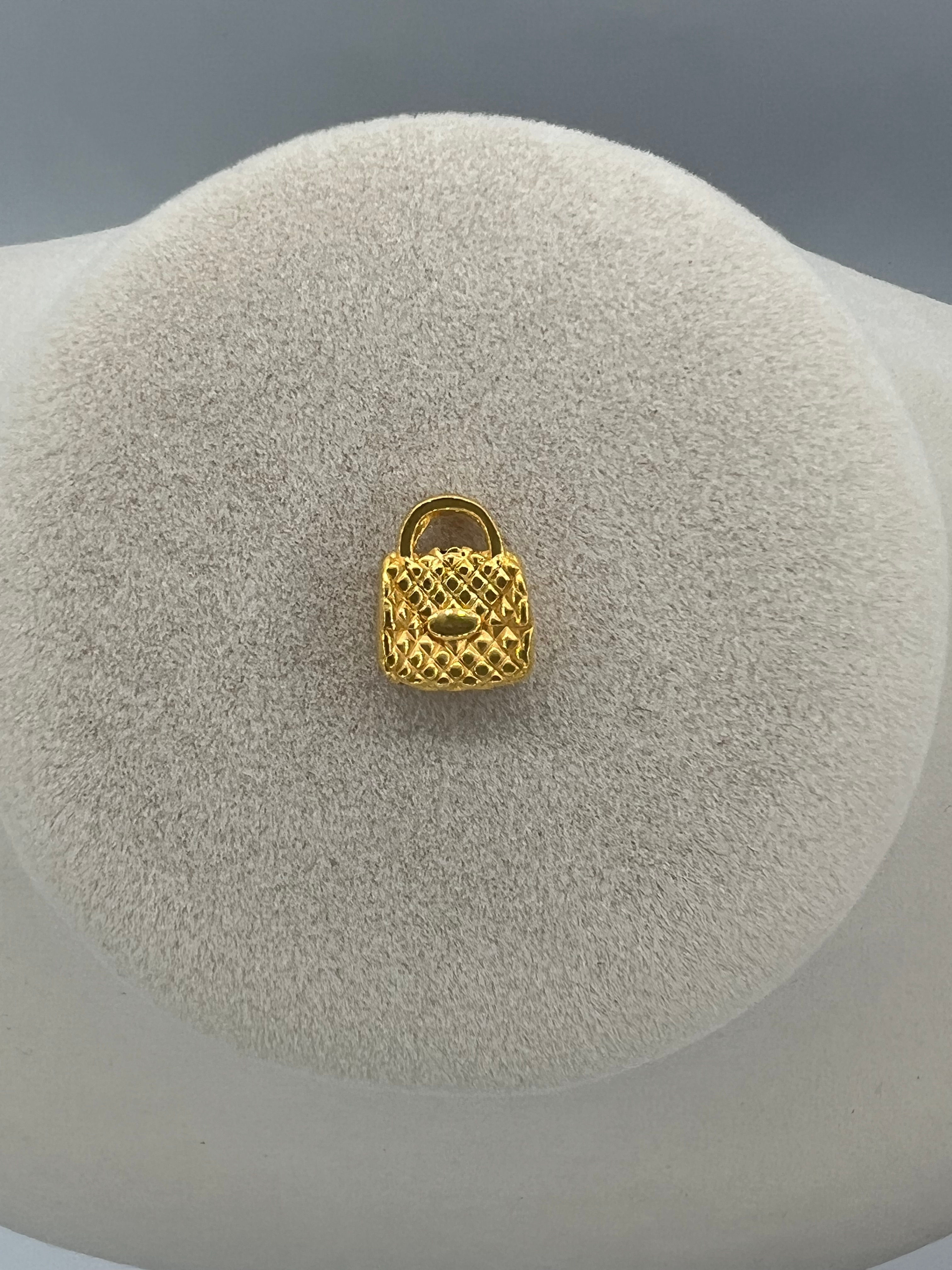 Beautiful gold Li Tresor bag pendant