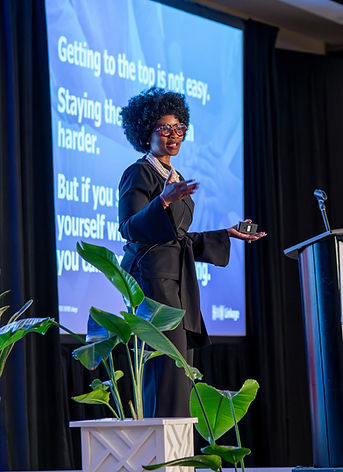 Tamla Oates-Forney delivering a keynote speech for a group of talent and leadership development professionals.