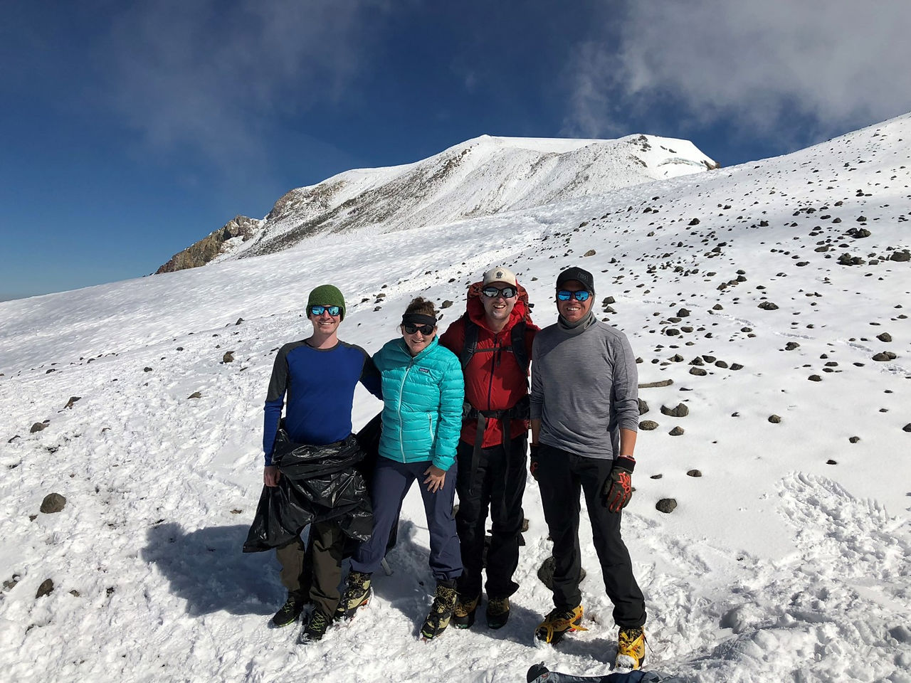 Jack, myself, Matt, and David at the false summit (actual peak in background)