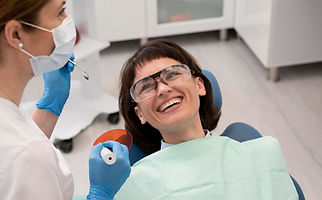 female-patient-having-procedure-done-dentist.jpg