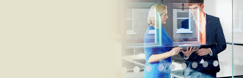 Business colleagues review project on tablet