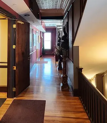 Hallway with wood floors and ornate details