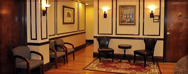 Elegant Downtown Executive Center waiting area with chairs and artwork