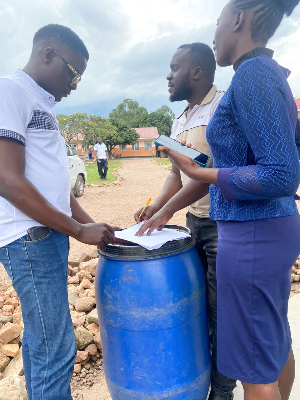 Team performing assessment of Ugandan school.