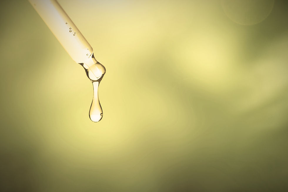 Pipette mit einem heraustropfenden Öl