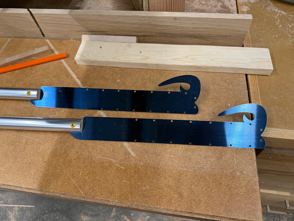 Close-up view of traditional fireknife equipment and safety gear laid out on a wooden table