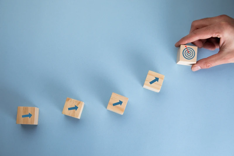 Blocks with Arrows Pointing Up Towards Target