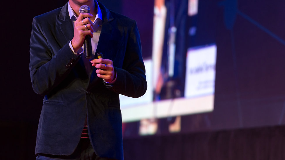 speaker-giving-talk-conference-hall-busi