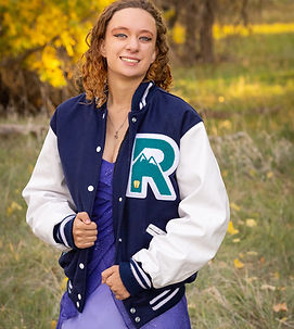 A female student wearing a letter jacket.