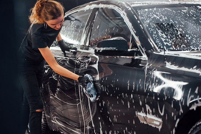 modern-black-automobile-get-cleaned-by-woman-insid-2025-03-18-21-32-17-utc.jpg