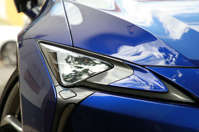 close-up-blue-car-parking-lot.jpg