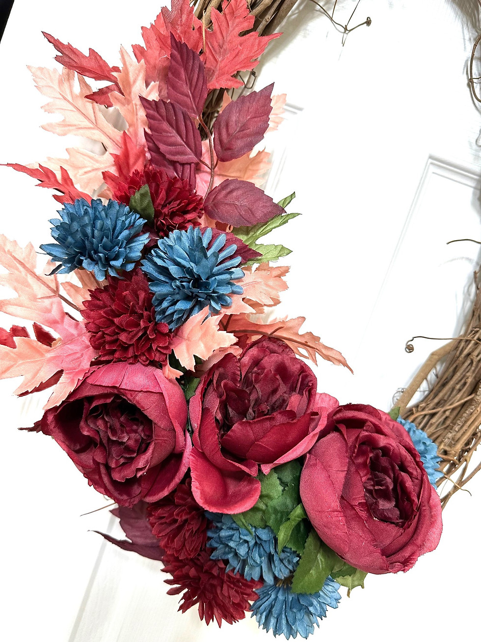 Close up of the floral work on the grapevine wreath