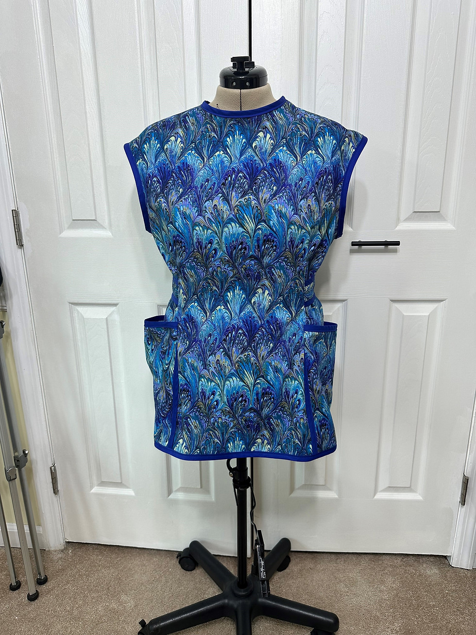 Front view of the blue cobbler apron with pockets