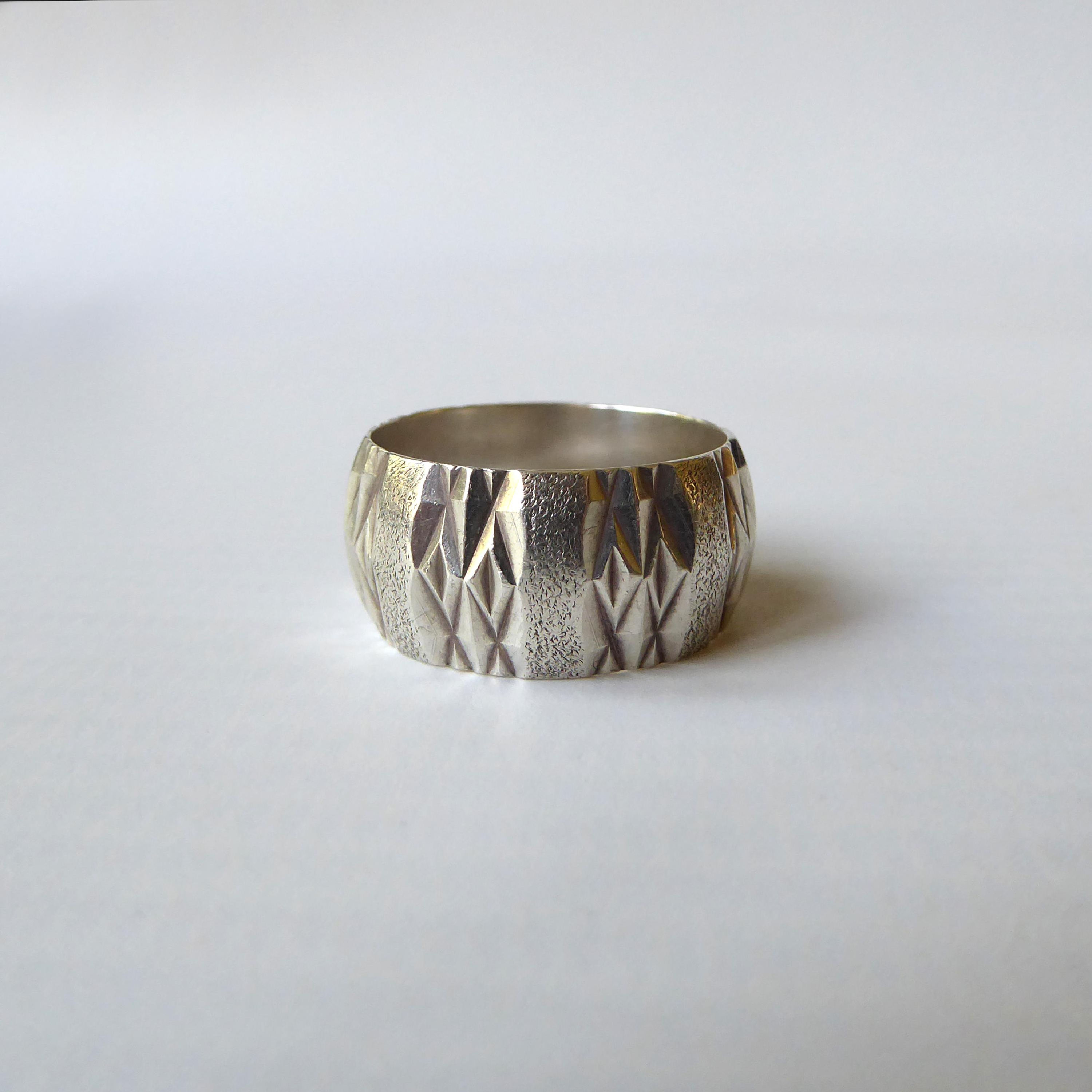 1979 sterling silver 925 ring, size O. Textured 10mm wide band, machine cut