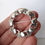 Thumbnail: Danish Erik Arvig 830 silver brooch. Modernist flower buds leaves ring circle