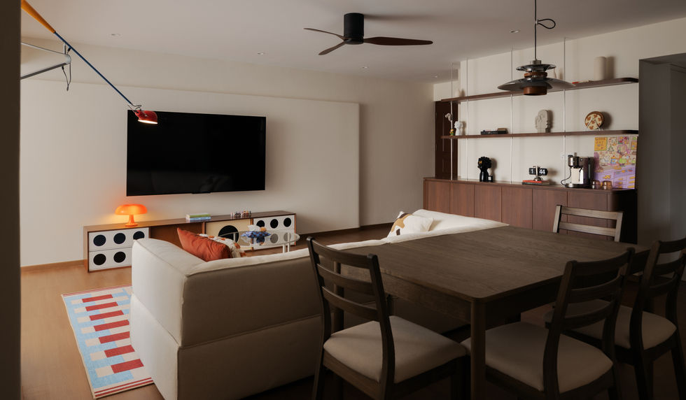 Mid-century modern living room design at 149 Rivervale Crescent Singapore with warm wood tones and clean lines.