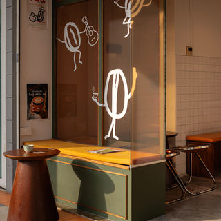 Cozy eclectic Komunal Cafe designed by Aart Boxx Interior.