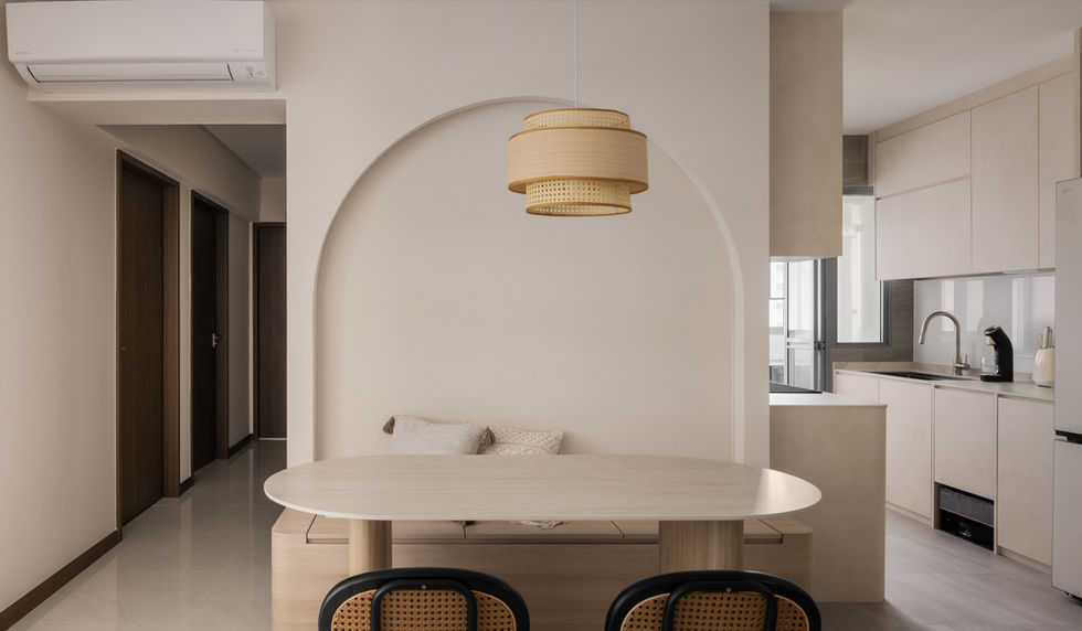 Dining area with arched niche, pendant light, and warm ambient lighting. 