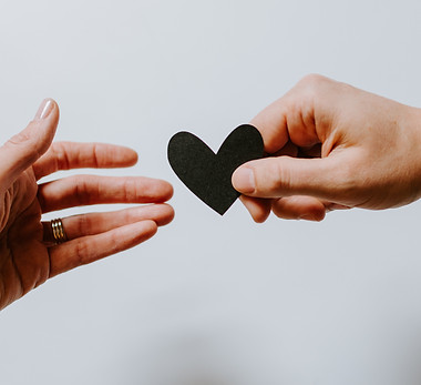 Man handing a woman a heart shape_edited.jpg