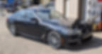 Side view of black sedan car