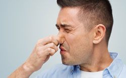 Man holding his nose