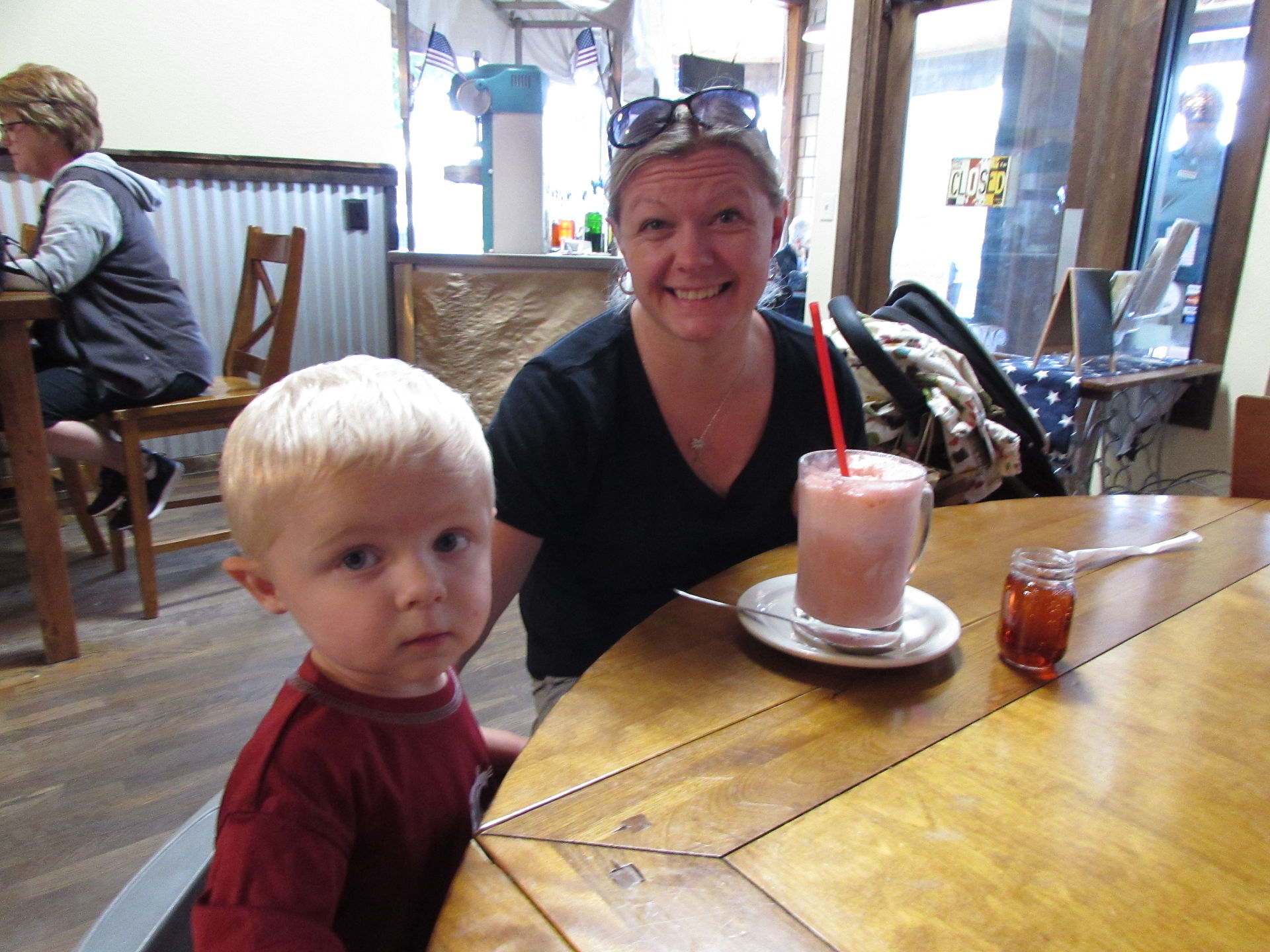 Mom and son enjoying an ice cream soda