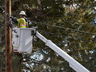 Lineman works on cable