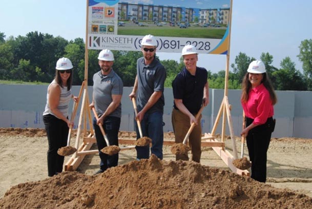 City Manager Rebecca Houseman breaks ground at the Ridgeview Lofts with members of the Fo