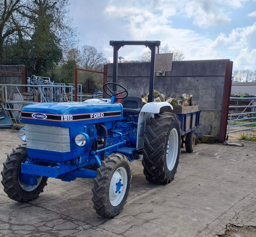 Ford 1910, built 1987, a compact utility tractor produced from 1983 to 1987. It features a 32 hp Shibaura 1.7L 3-cylinder diesel engine, with tested PTO horsepower at 28.60 hp and drawbar horsepower at 24.76 hp. The tractor was built by Shibaura in Japan and distributed by Ford. It came in 2WD and 4WD variants.