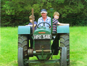 Anthony Langdale on his beloved Fordson Model N, with his grandsons.