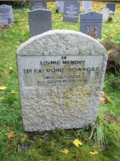 Sir Raymond Brown is buried in All Saints Churchyard, Witley