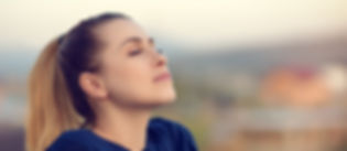 Healthy woman relaxing after acupuncture treatment.