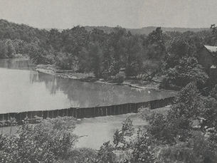 Black and white photograph of the dam and mill at Oasis, Missouri, circa 1926.