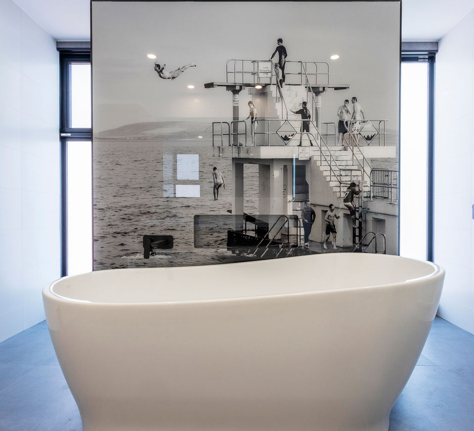 free standing bath, printed glass screen partitions, natural light
