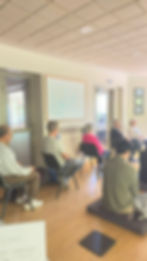 People in a room at an Agama International session